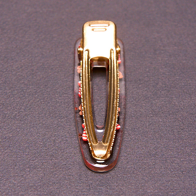 barrette à cheveux artisanale en résine, mon petit bonhomme de pain d'épice. Ornée de bonhommes de pain d'épices et de cannes à sucre. parfaite pour noël